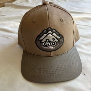 NWT unisex snap back hat khaki tan & green with mountains and bike logo